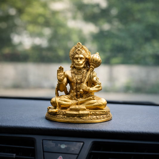 Side angle of Lord Hanuman Ji car dashboard idol in gold finish
