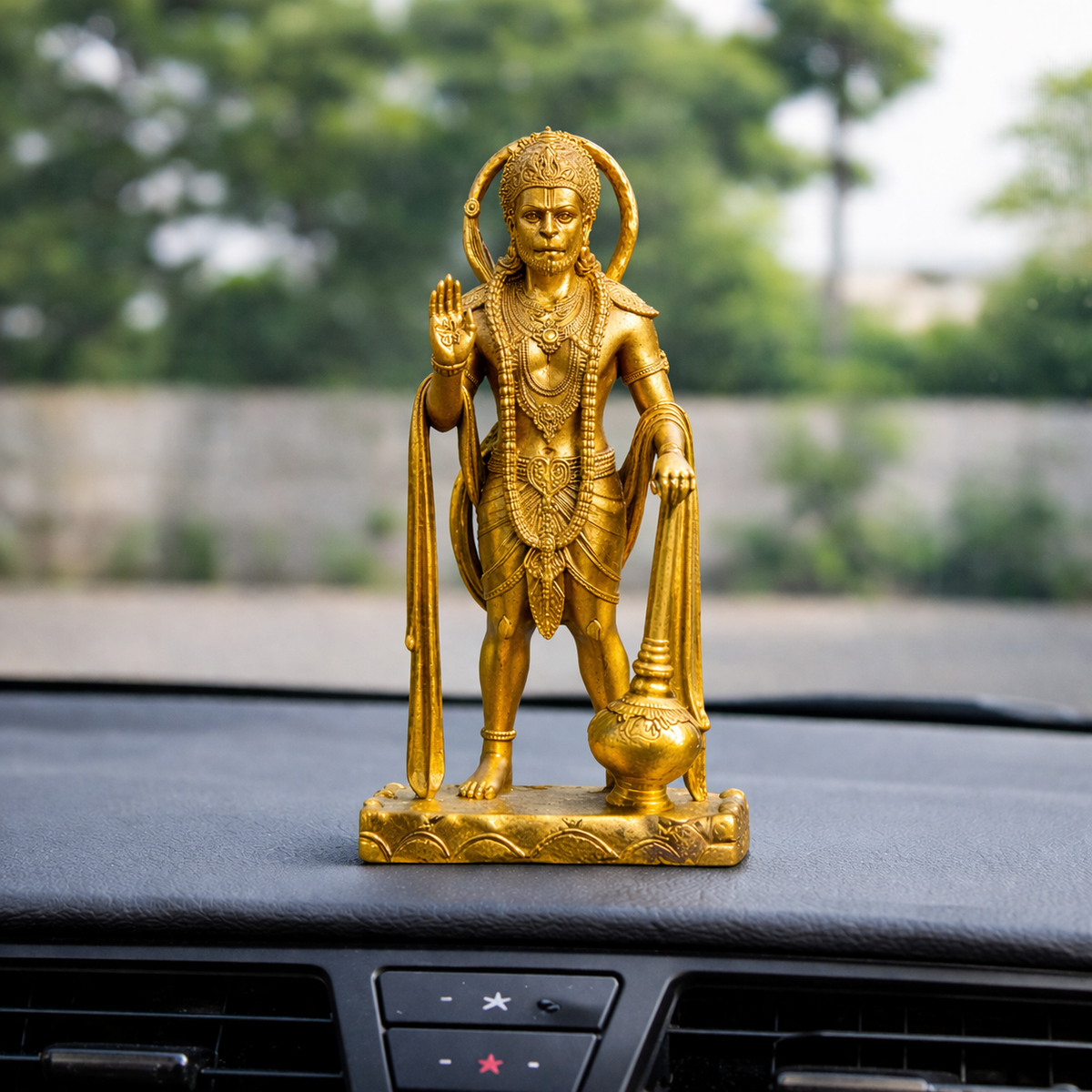 Sarangpur Hanuman idol mounted on car dashboard for protection on the road